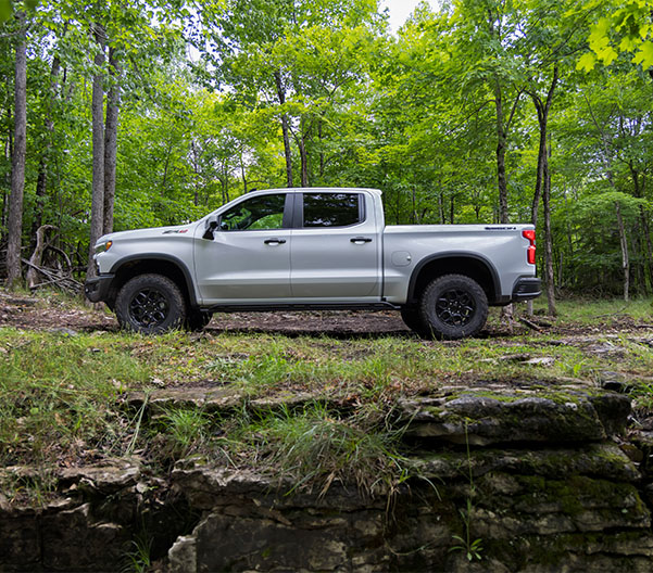 2023 Chevy Silverado 1500 parked in the middle of a forest.