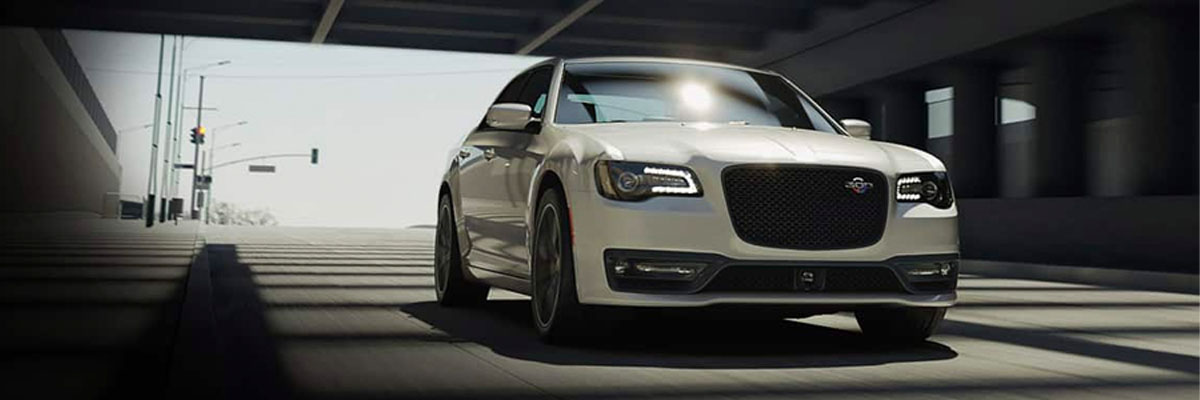 2023 Chrysler 300C driving along an urban road