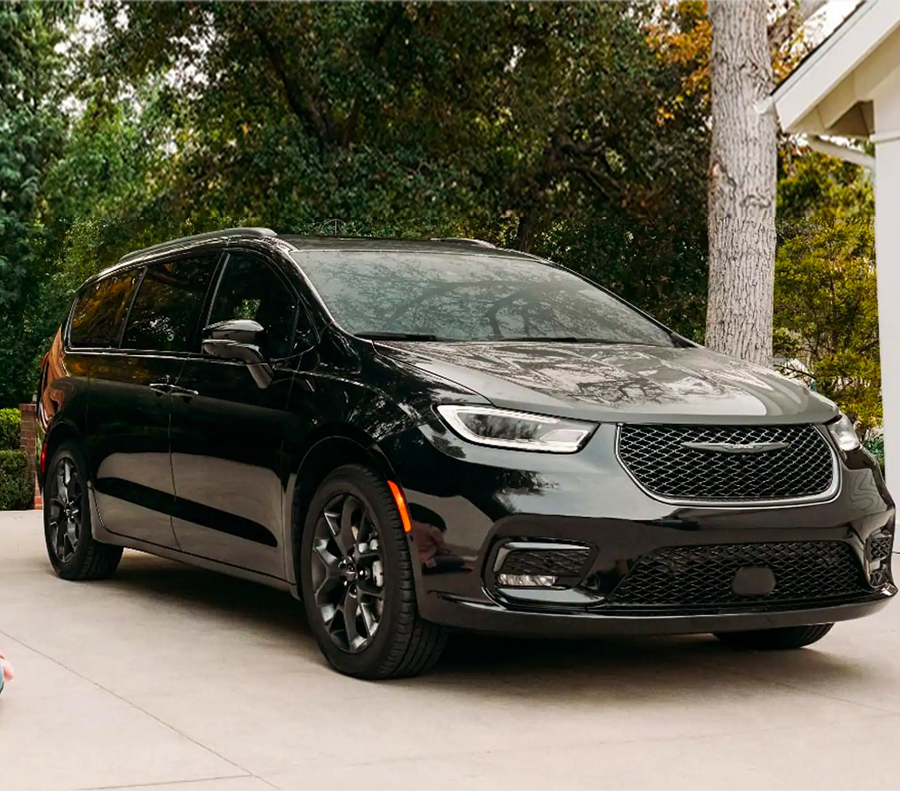 2023 Chrysler Pacifica parked outside a house in a driveway