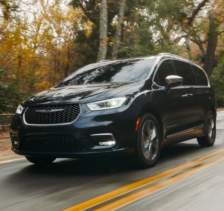 2023 Chrysler Pacifica driving on a wet road