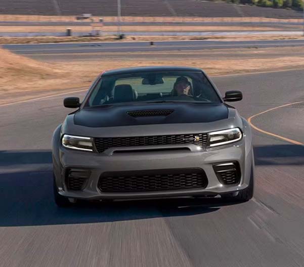 Front view of the 2023 Dodge Charger racing along a track