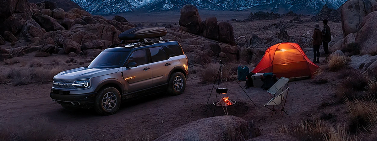 2023 Ford Bronco Sport parked in the mountains next to a tent