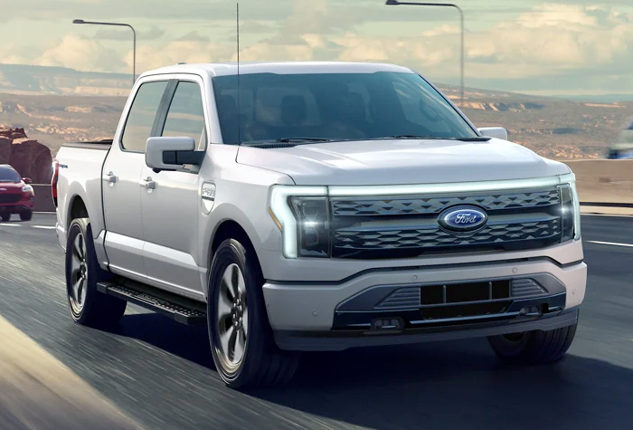 A 2023 Ford F-150 Lightning® being driven on a highway