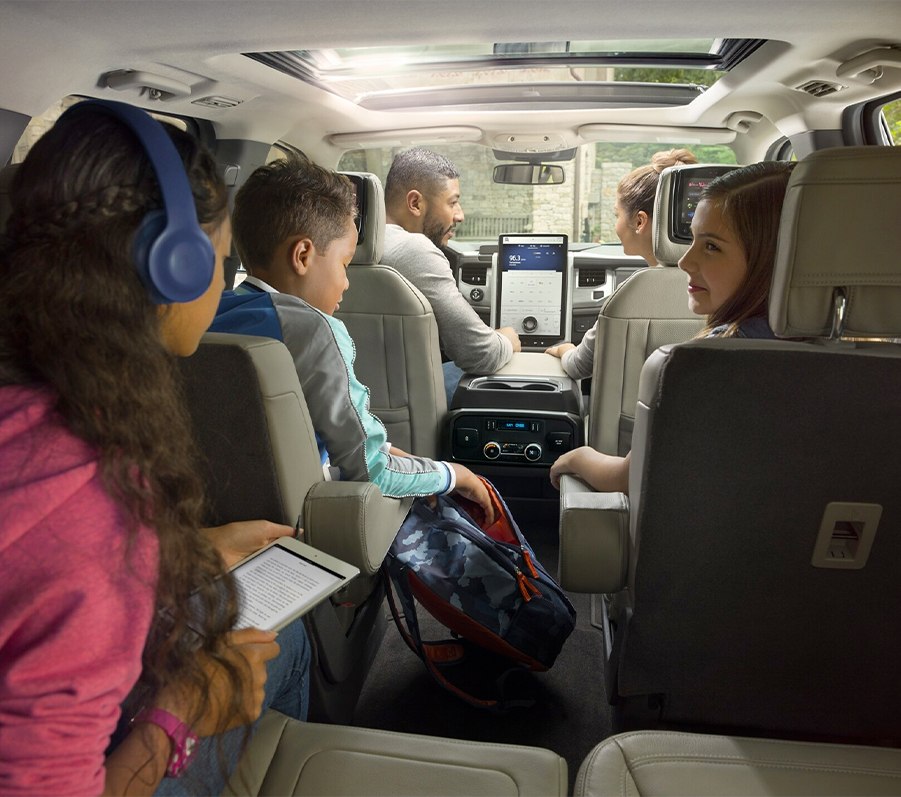 A family of five sitting in a 2023 Ford Expedition SUV