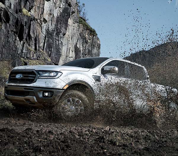 2023 Ford Ranger off-road driving through mud