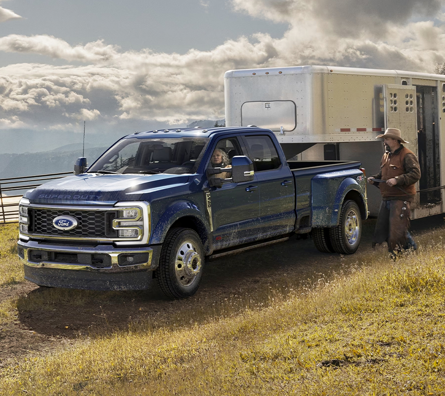 2023 Ford Super Duty® F-450® King Ranch® DRW hitched to a horse trailer