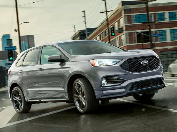 The 2023 Ford Edge driving along a city street
