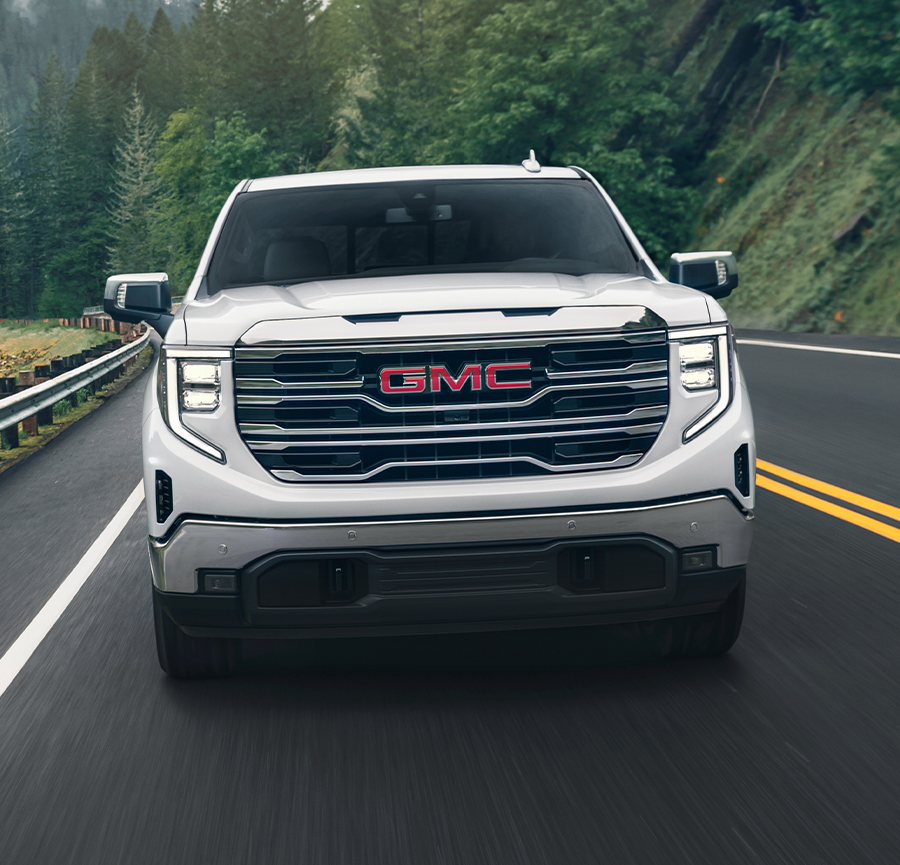 The Sierra 1500 Cruising on an Open Mountain Road