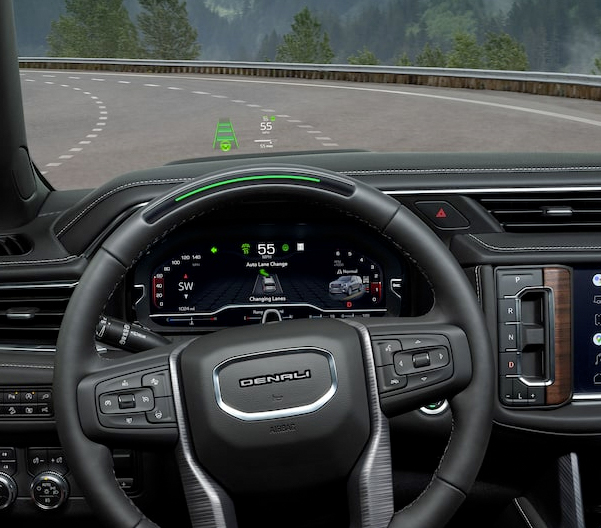 Interior shot of the 2023 GMC Yukon steering wheel and head-up display