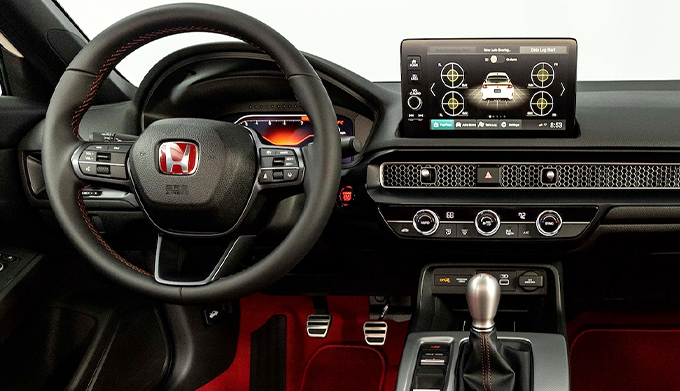Interior view of front seats, steering wheel, and dash in the 2023 Honda Civic Type R.