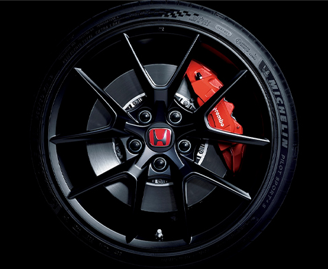 Detail view of an alloy wheel with Brembo® brake caliper on the 2023 Honda Civic Type R.