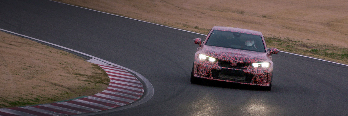 2022 Honda Civic Type R Prototype shown. Driving on a race track