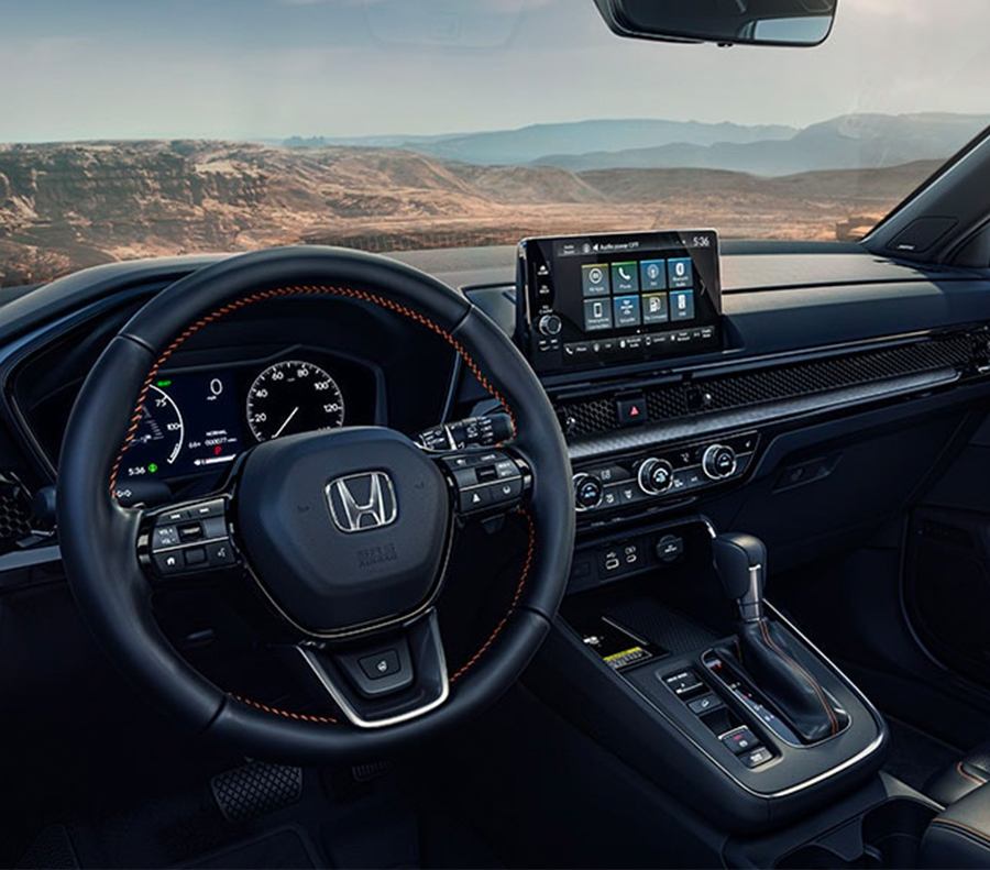 Front dashboard shot of 2023 Honda CR-V interior.
