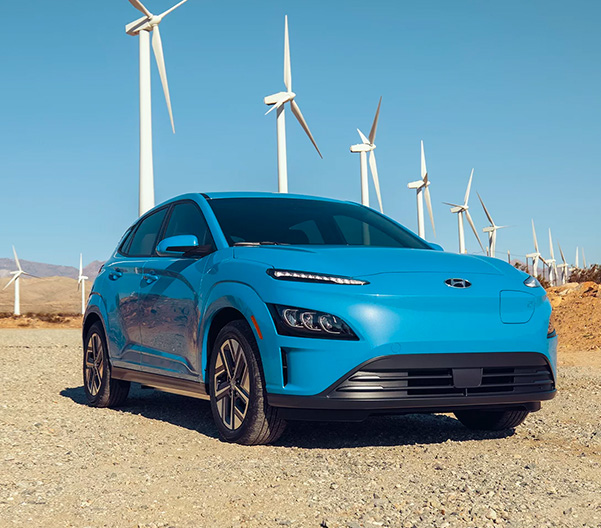 blue 2023 Kona Electric parked in the desert