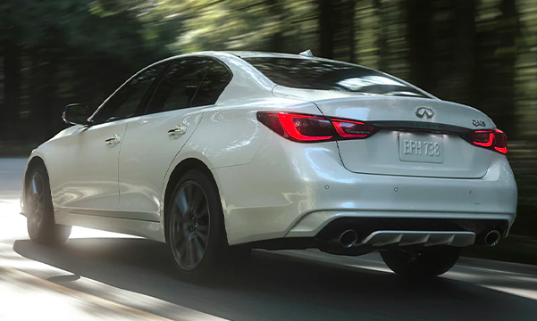 Rear profile view of 2023 INFINITI Q50 highlighting rear lights and performance-inspired exterior design