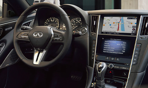 Interior view of 2023 INFINITI Q50 highlighting the driver console and gear shifter
