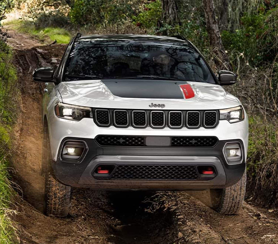 2023 Jeep Compass 4X4 driving along a rural road