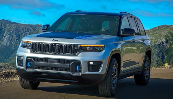 2023 Jeep Grand Cherokee 4XE driving along a road.