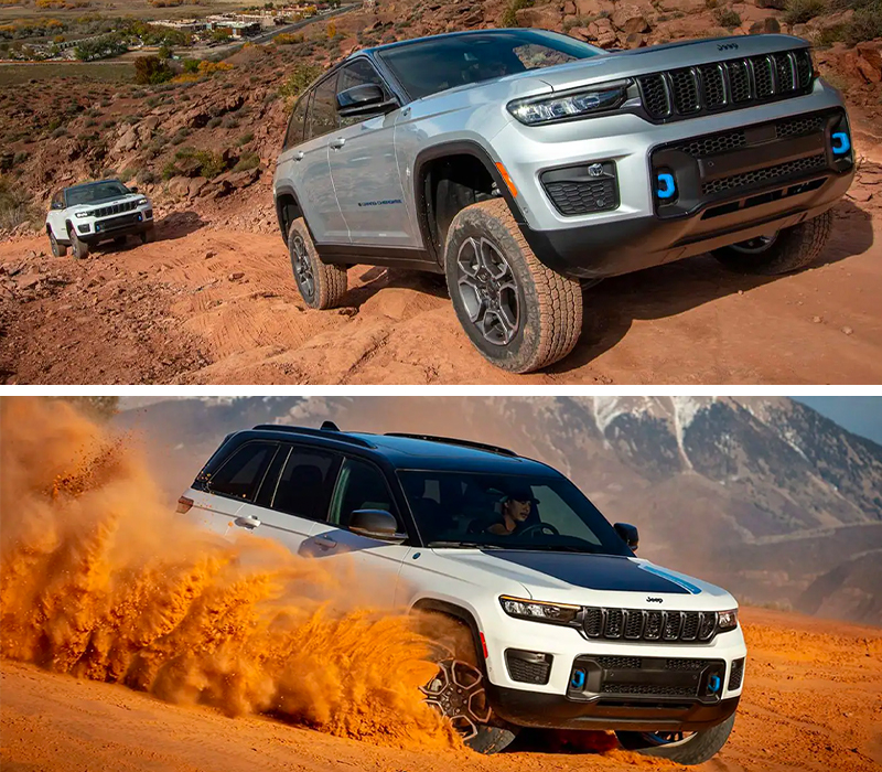 The 2023 Jeep Grand Cherokee 4xe being driven in the desert with a cloud of red sand obscuring its wheels.
