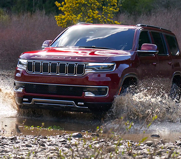 2023 WAGONEER driving through a creek