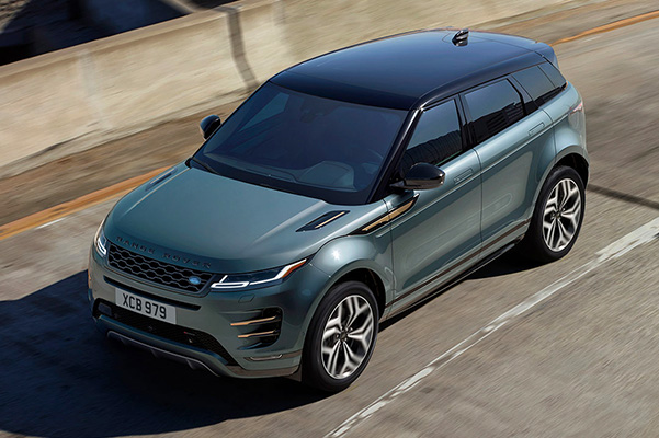 Exterior shot of a 2023 Range Rover Evoque driving on a city street.