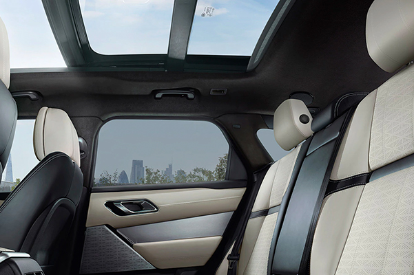 Interior shot of back seats in a 2023 Range Rover Velar.