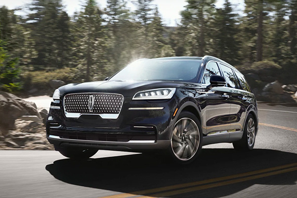 2023 Lincoln Aviator turning a corner on the road