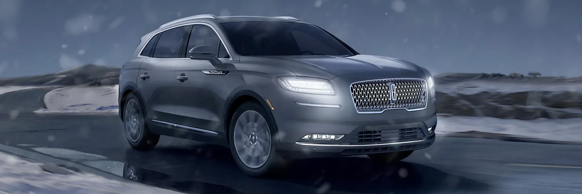 A 2023 Lincoln Nautilus® SUV is driven on a snowy road