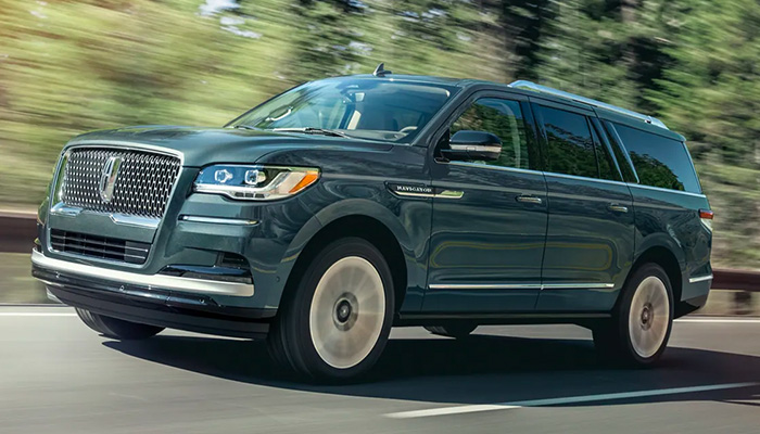 Side profile of a 2023 Lincoln Navigator in action