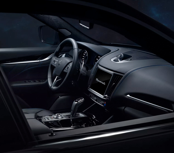 Interior of the 2023 Maserati Levante showing the steering wheel and HD touch screen