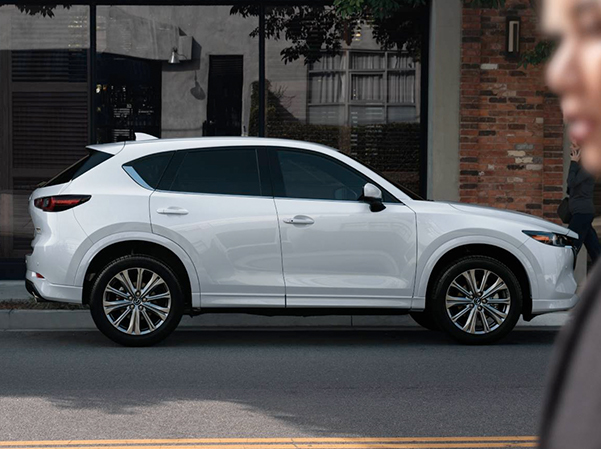 The 2023 Mazda CX-5 parallel parked on the side of the road