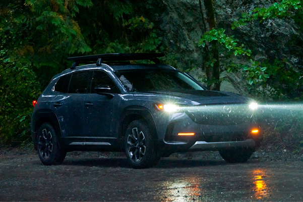 Adaptive front-lighting system in action on the 2023 Mazda CX-50 in rain