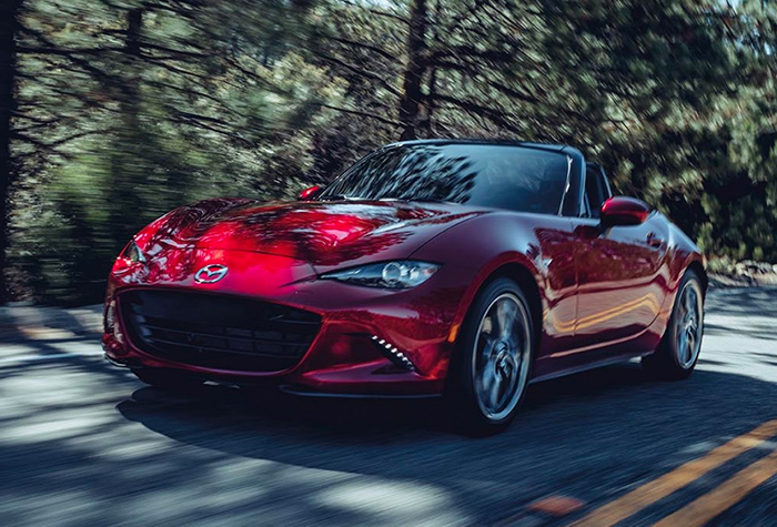 2023 Mazda MX-5 Miata driving on a road