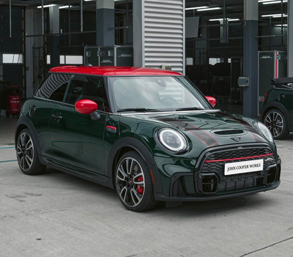 The MINI John Cooper Works parked in front of garage.