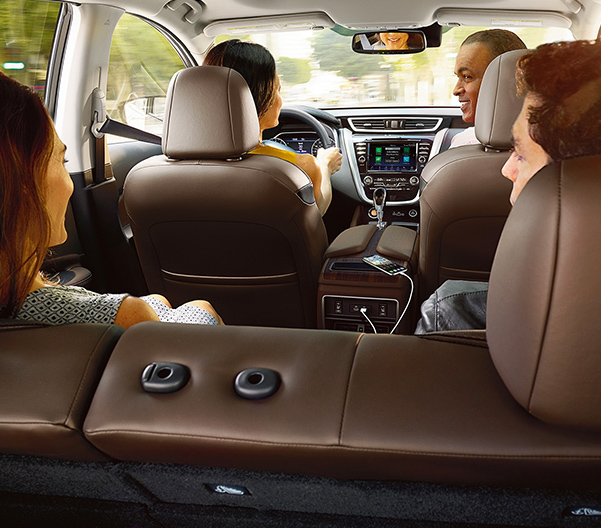 Shot from trunk of car showing family sitting inside of the 2023 Nissan Murano.
