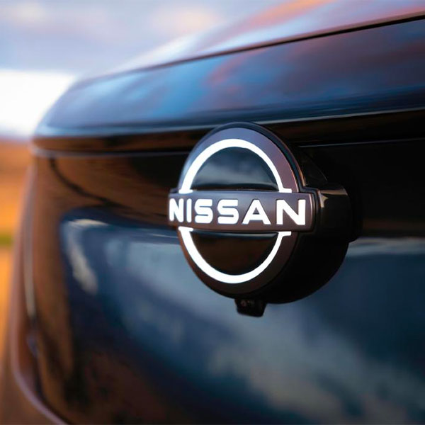 Up close shot of front bumper Nissan badge on new model