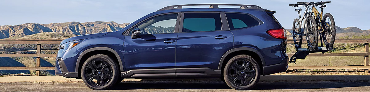 Side view of the 2023 Subaru Ascent with bikes on the tow hitch