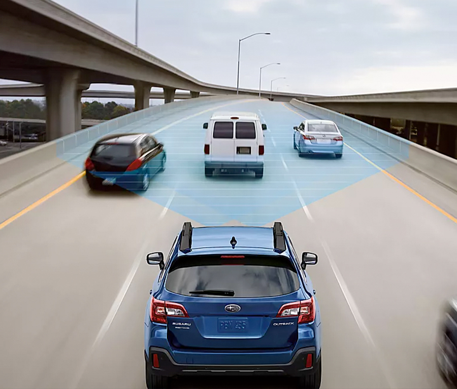 An Ascent driving down the highway with a blue graphic showing the EyeSight Drive feature