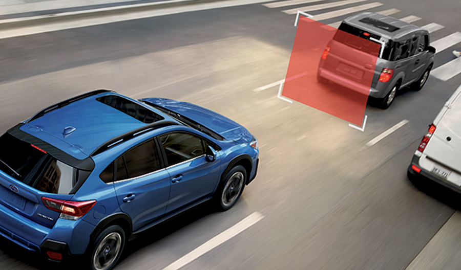 An Ascent driving down the highway with a blue graphic showing the EyeSight Drive feature