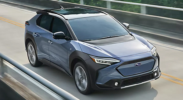 The 2023 Solterra electric SUV driving on a bridge