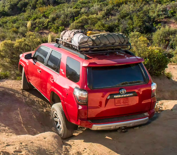 Rear view of the 4Runner driving along a rocky terrain