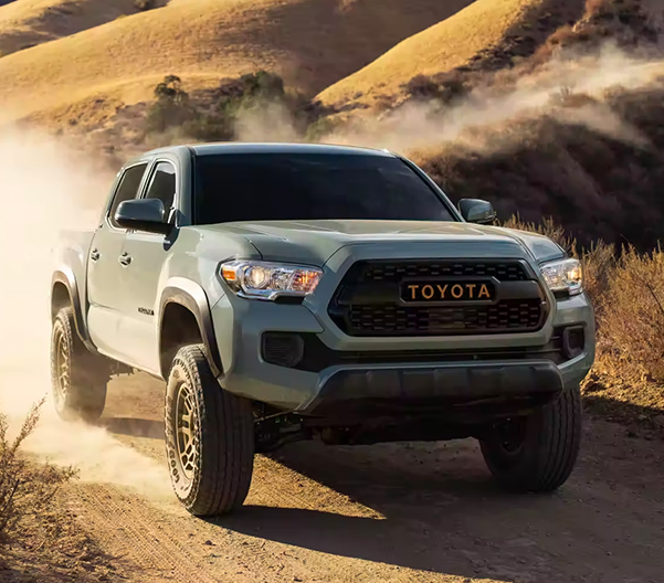 2023 Toyota Tacoma driving on a dusty trail