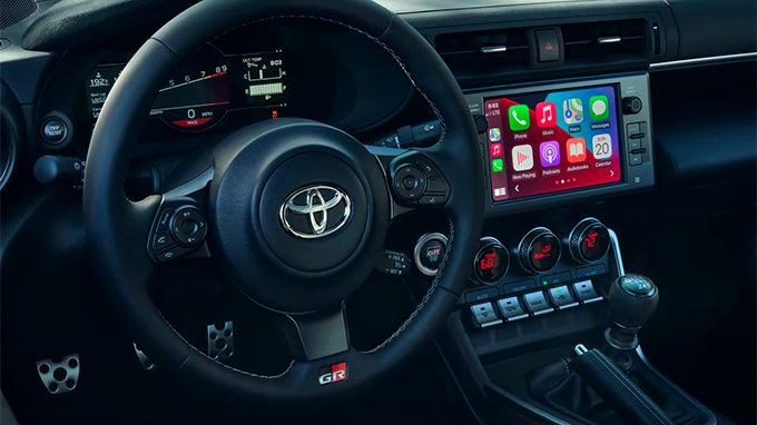 GR86 Premium interior shown in Ultrasuede® and Black leather trim. Apple CarPlay® compatibility shown. Prototype shown. Screen depiction accurate at time of posting.