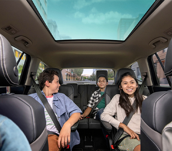 Interior view of an Atlas with people sitting in the second and third rows.