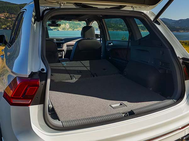 Interior seats folded down in a 2023 VW Tiguan showcasing cargo room