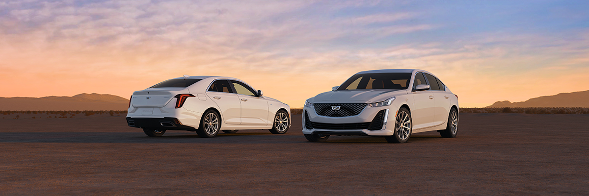 Two Cadillac Sedans parked 