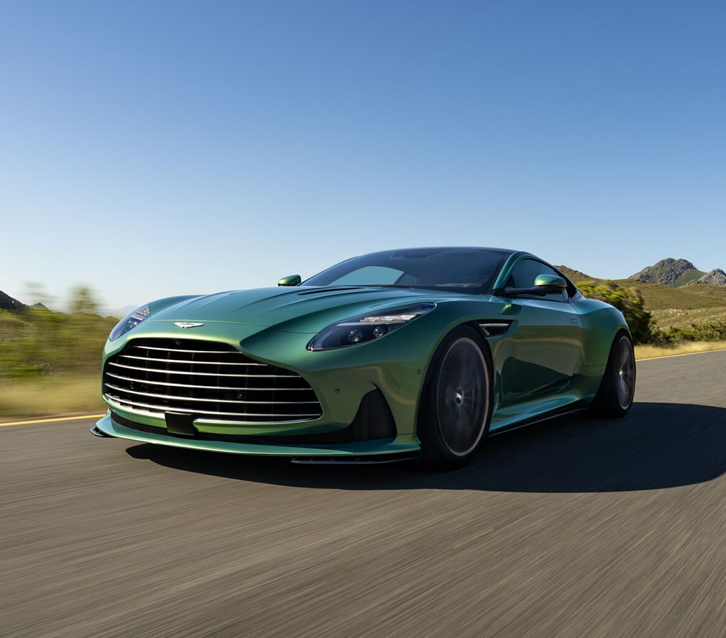 2024 Aston Martin DB12 driving down a road