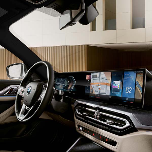Interior shot of a 2024 BMW i4 with a 15 inch Standard Touchscreen