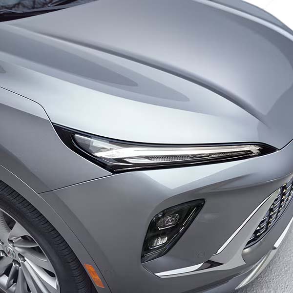 Zoomed in shot of the 2024 Buick Envision's hood showcasing it's signature LED headlamps