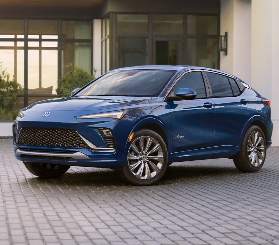 The Brand New Buick Envista in Blue Parked in a Driveway.